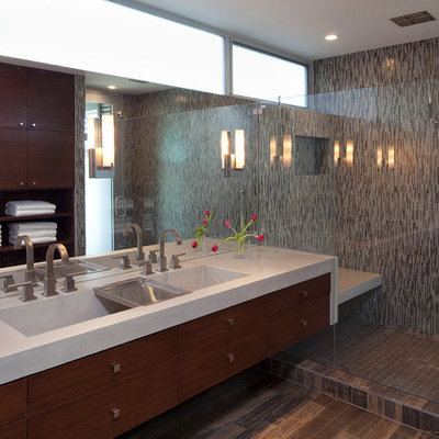 Alcove shower - large contemporary master mosaic tile, black tile, brown tile and gray tile porcelain tile alcove shower idea in Austin with flat-panel cabinets, medium tone wood cabinets, multicolored walls, a trough sink and quartz countertops