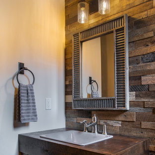 Inspiration for a small rustic single-sink and wood wall bathroom remodel in Seattle with dark wood cabinets, beige walls, a drop-in sink, wood countertops and a freestanding vanity
