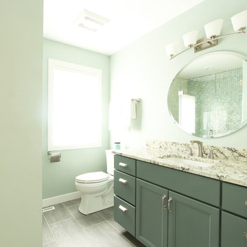 Lakeside Bathroom with Blue Vanity and Glass Accent Tile