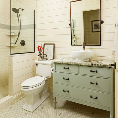 Mid-sized farmhouse 3/4 white tile and subway tile mosaic tile floor bathroom photo in Minneapolis with a two-piece toilet, a vessel sink, marble countertops, flat-panel cabinets, green cabinets and beige walls