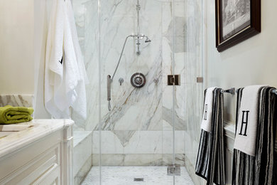 Inspiration for a small timeless 3/4 white tile and stone slab marble floor alcove shower remodel in New York with raised-panel cabinets, white cabinets, white walls, an undermount sink and marble countertops