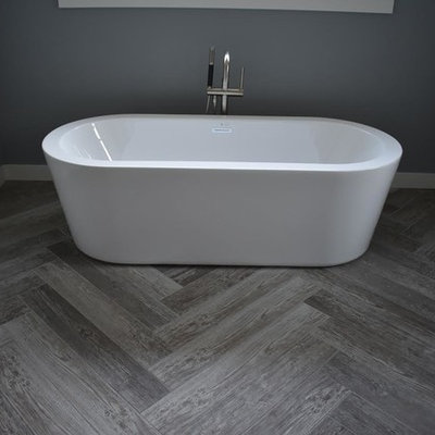 Mid-sized transitional master gray tile, white tile and porcelain tile porcelain tile and gray floor bathroom photo in Minneapolis with raised-panel cabinets, gray cabinets, a two-piece toilet, gray walls, a vessel sink and quartz countertops