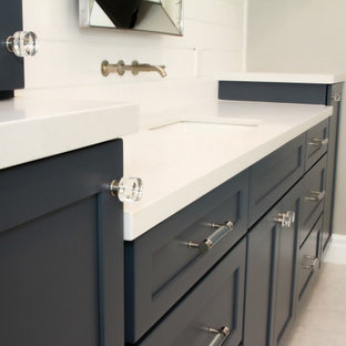 This is an example of a large beach style master bathroom in Los Angeles with blue cabinets, a freestanding tub, an alcove shower, a one-piece toilet, white tile, beige walls, a drop-in sink, engineered quartz benchtops, yellow floor, an open shower, white benchtops, a shower seat, a single vanity, a built-in vanity and planked wall panelling.
