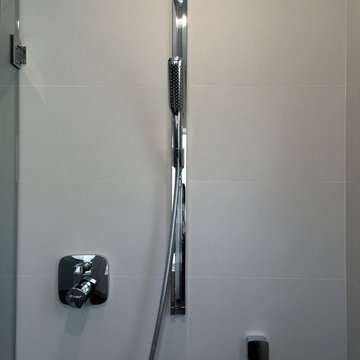 large-format tile with hansgrohe rain shower