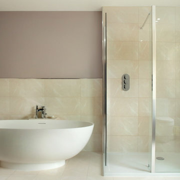 Large modern bathroom with freestanding oval bath