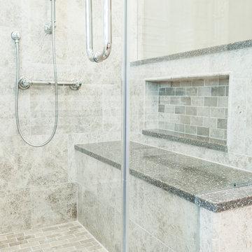 Large tiled shower with bench and frameless glass shower enclosure