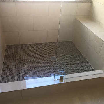 Large traditional walk in shower with bench