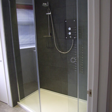 large walk-in shower enclosure with stylish electric shower