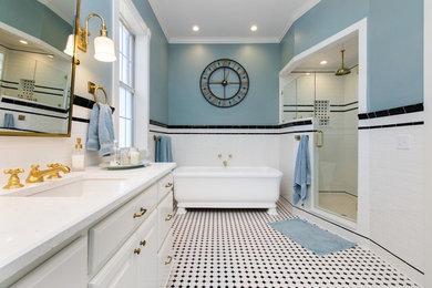 Transitional master white tile mosaic tile floor bathroom photo in Other with raised-panel cabinets, white cabinets, blue walls, quartz countertops, a hinged shower door and white countertops
