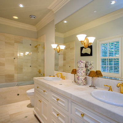 Bathroom - traditional beige tile bathroom idea in San Francisco with a drop-in sink, white cabinets and recessed-panel cabinets