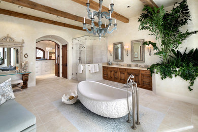 Example of a huge tuscan master beige tile and ceramic tile travertine floor and beige floor bathroom design in San Francisco with medium tone wood cabinets, an undermount sink, beige walls, a hinged shower door and recessed-panel cabinets