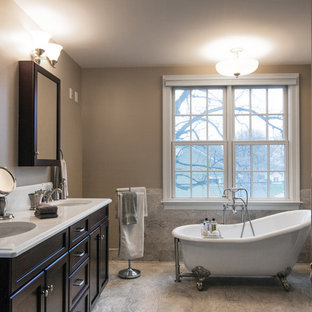 Bathroom - large traditional master gray tile and porcelain tile porcelain tile bathroom idea in DC Metro with recessed-panel cabinets, dark wood cabinets, a two-piece toilet, gray walls, an undermount sink and solid surface countertops