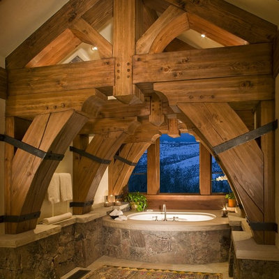Inspiration for a rustic master bathroom remodel in Denver with an undermount tub