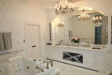 Large transitional master marble floor bathroom photo in Dallas with raised-panel cabinets, white cabinets, white walls, an undermount sink and marble countertops