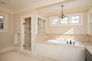 Inspiration for a mid-sized timeless master beige tile and ceramic tile travertine floor and beige floor bathroom remodel in Boston with beige walls and a hinged shower door