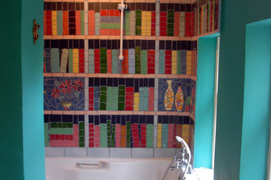 Photo of an eclectic bathroom in Other with a built-in bath, multi-coloured tiles and ceramic tiles.