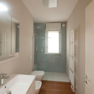 Light blue bathroom with bamboo flooring