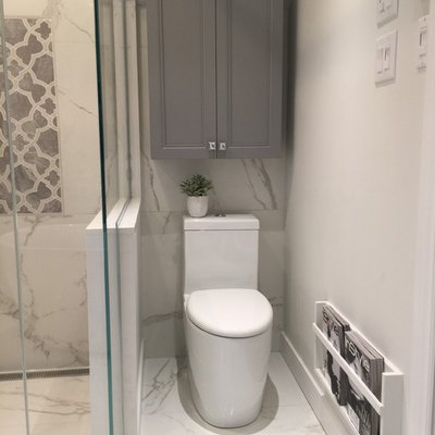 Inspiration for a large transitional master white tile and porcelain tile porcelain tile bathroom remodel in Montreal with furniture-like cabinets, gray cabinets, a one-piece toilet, gray walls, an undermount sink and quartz countertops