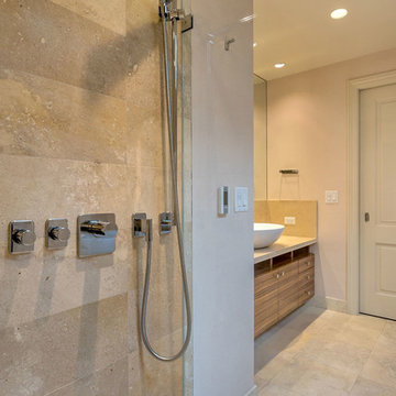 Limestone shower with Dornbracht shower controls