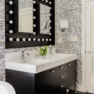 Inspiration for a large transitional master black tile and mosaic tile mosaic tile floor and black floor bathroom remodel in Boston with an integrated sink, furniture-like cabinets, black cabinets, multicolored walls and laminate countertops