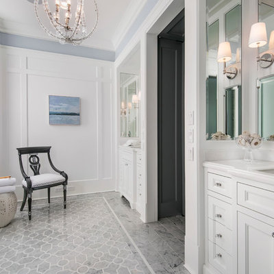 Freestanding bathtub - large traditional master gray tile and stone tile porcelain tile freestanding bathtub idea in Chicago with recessed-panel cabinets, white cabinets, an undermount sink, a two-piece toilet and white walls