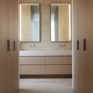 Photo of a contemporary bathroom in Melbourne with flat-panel cabinets, light wood cabinets, beige walls, white floor and beige benchtops.