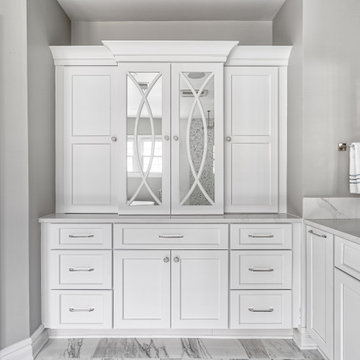 Linen Cabinetry with Mirrored Doors and Plenty of Storage