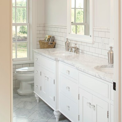 Example of a mid-sized classic master white tile and subway tile ceramic tile bathroom design in Seattle with an undermount sink, furniture-like cabinets, white cabinets, white walls, marble countertops and white countertops