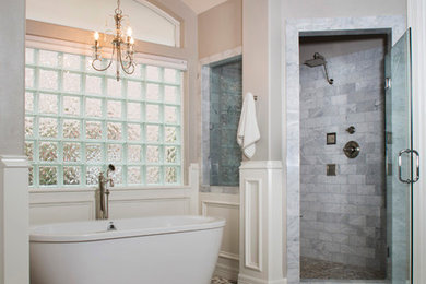 Bathroom - large transitional master gray tile and porcelain tile pebble tile floor bathroom idea in Houston with gray walls, an undermount sink, recessed-panel cabinets, gray cabinets and a hinged shower door
