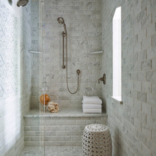 Photo of a classic bathroom in Minneapolis with an alcove shower, grey tiles, marble tiles and a shower bench.
