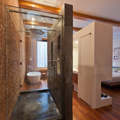 Inspiration for a contemporary slate tile freestanding bathtub remodel in New York