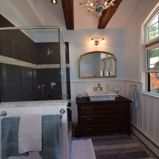 Inspiration for a mid-sized rustic master black tile and ceramic tile ceramic tile doorless shower remodel in New York with furniture-like cabinets, dark wood cabinets, a two-piece toilet, blue walls and a vessel sink
