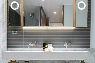 Photo of a modern bathroom in Hampshire with grey walls and marble flooring.