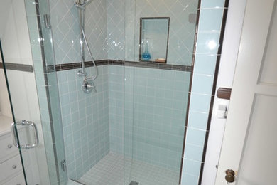 Example of a small classic 3/4 multicolored tile and porcelain tile porcelain tile alcove shower design in Los Angeles with flat-panel cabinets, white cabinets, white walls, an undermount sink and quartz countertops