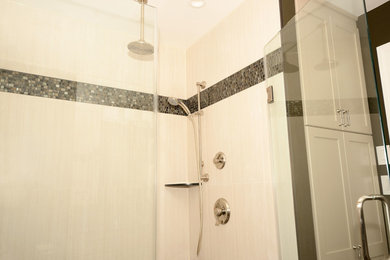 Inspiration for a mid-sized modern master black and white tile and glass sheet porcelain tile alcove shower remodel in DC Metro with recessed-panel cabinets, beige cabinets, a two-piece toilet, green walls, an undermount sink and granite countertops