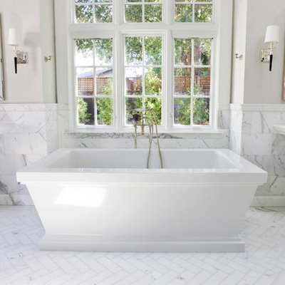 Example of a classic subway tile freestanding bathtub design in San Francisco with a pedestal sink