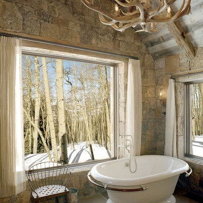 Freestanding bathtub - rustic freestanding bathtub idea in Denver