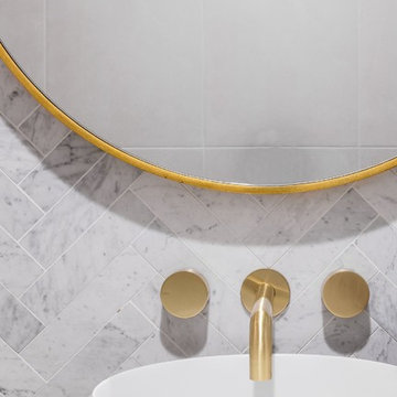 Lux powder - marble herringbone tiles & chrome mixer