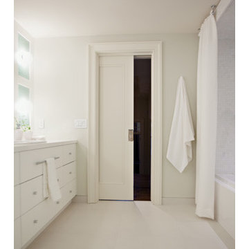 Luxe bathroom with pocket door