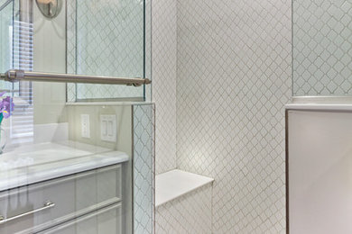 Inspiration for a small timeless master beige tile and porcelain tile porcelain tile alcove shower remodel in Minneapolis with furniture-like cabinets, beige cabinets, a one-piece toilet, white walls, an undermount sink and quartz countertops