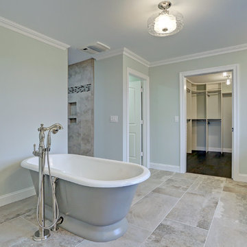 Luxurious Master Bath with Marble Countertops and Walk-in Closet