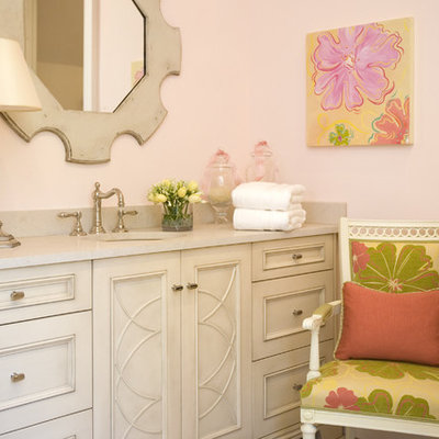 Inspiration for a large eclectic kids' white tile and stone tile travertine floor drop-in bathtub remodel in Atlanta with limestone countertops, an undermount sink, white cabinets, pink walls, a two-piece toilet and recessed-panel cabinets