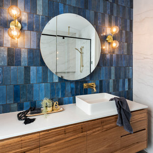 Contemporary master bathroom in Geelong with engineered quartz benchtops, white benchtops, flat-panel cabinets, medium wood cabinets, an alcove shower, blue tile and a vessel sink.