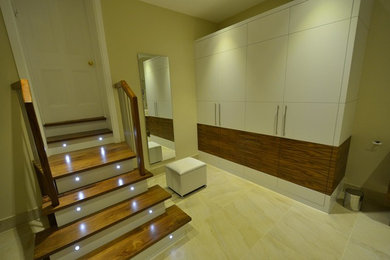Contemporary family bathroom in Surrey with medium wood cabinets and beige walls.