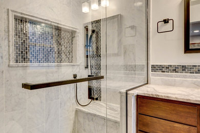 Mid-sized transitional gray tile and marble tile bathroom photo in Milwaukee with an undermount sink, marble countertops, a hinged shower door and gray countertops