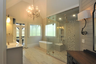 Example of a large trendy master gray tile bathroom design in Atlanta with flat-panel cabinets, gray cabinets, gray walls, quartzite countertops, a hinged shower door and white countertops