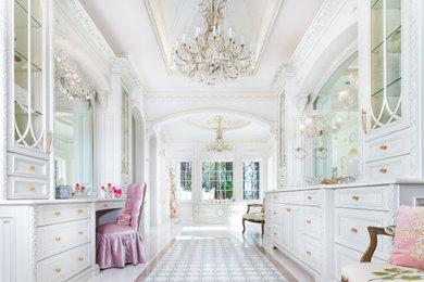 Inspiration for a large victorian master white tile and marble tile marble floor, white floor, single-sink and tray ceiling drop-in bathtub remodel in Orlando with recessed-panel cabinets, white cabinets, white walls, a drop-in sink, marble countertops, white countertops and a built-in vanity