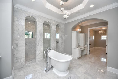 Example of a large transitional master bathroom design in Tampa with an undermount sink