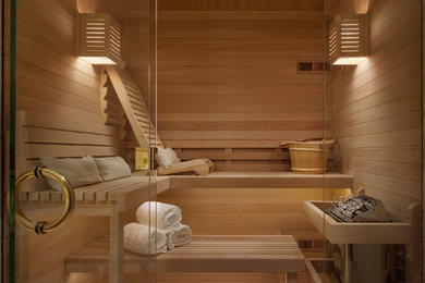 Example of a mid-sized trendy light wood floor and beige floor sauna design in San Francisco with brown walls, a hinged shower door, shaker cabinets, medium tone wood cabinets, a two-piece toilet, an undermount sink and quartz countertops