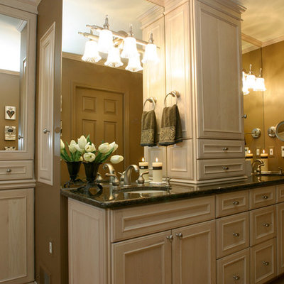 Bathroom - traditional bathroom idea in Detroit with an undermount sink, recessed-panel cabinets and light wood cabinets